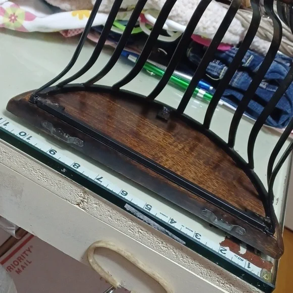 Beautiful accent shelf black worght iron basket dark wood shelf and bottom